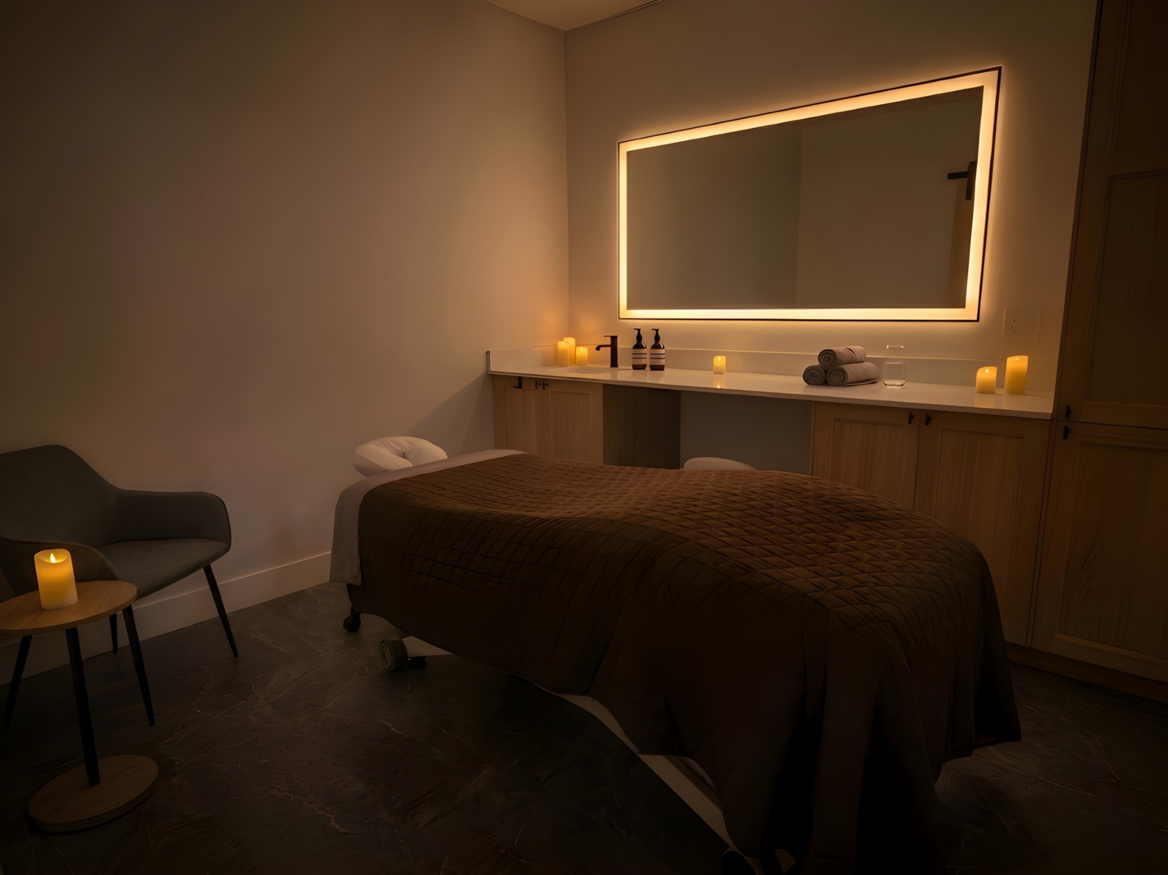 ReviveCare massage therapy room with candlelit ambiance